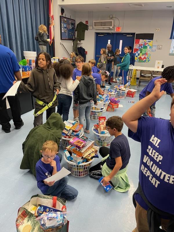 Students packing donated Thanksgiving items