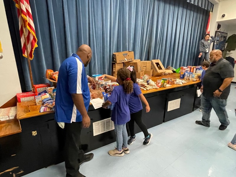 Students packing donated Thanksgiving items