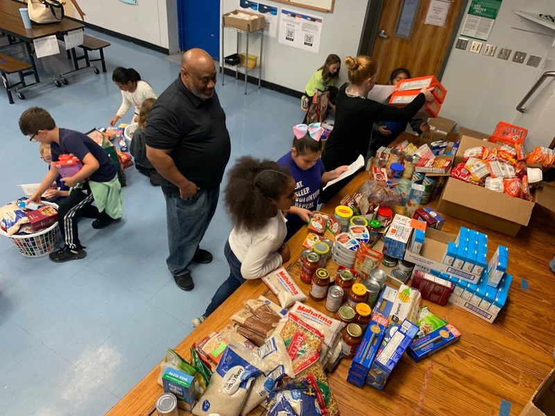 Students packing donated Thanksgiving items