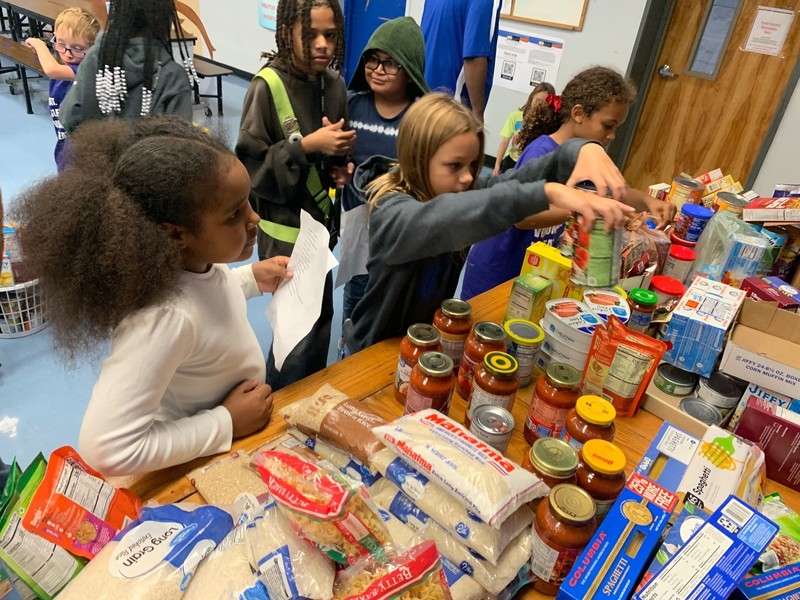 Students packing donated Thanksgiving items